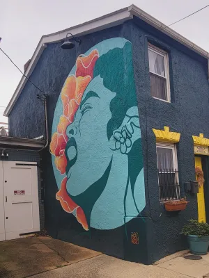 A mural by Jaz Erenberg honors Billie Holiday on Lady Day Way. Photo credit: Ed Gunts.