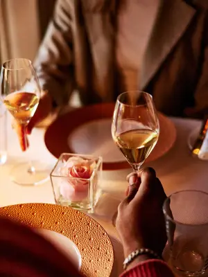 Diners enjoying wine. Photo courtesy Charleston.