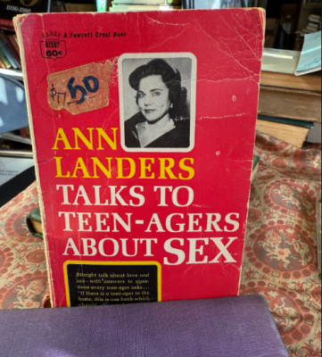 photo of red book titled "Ann Landers Talks to Teenagers About Sex"