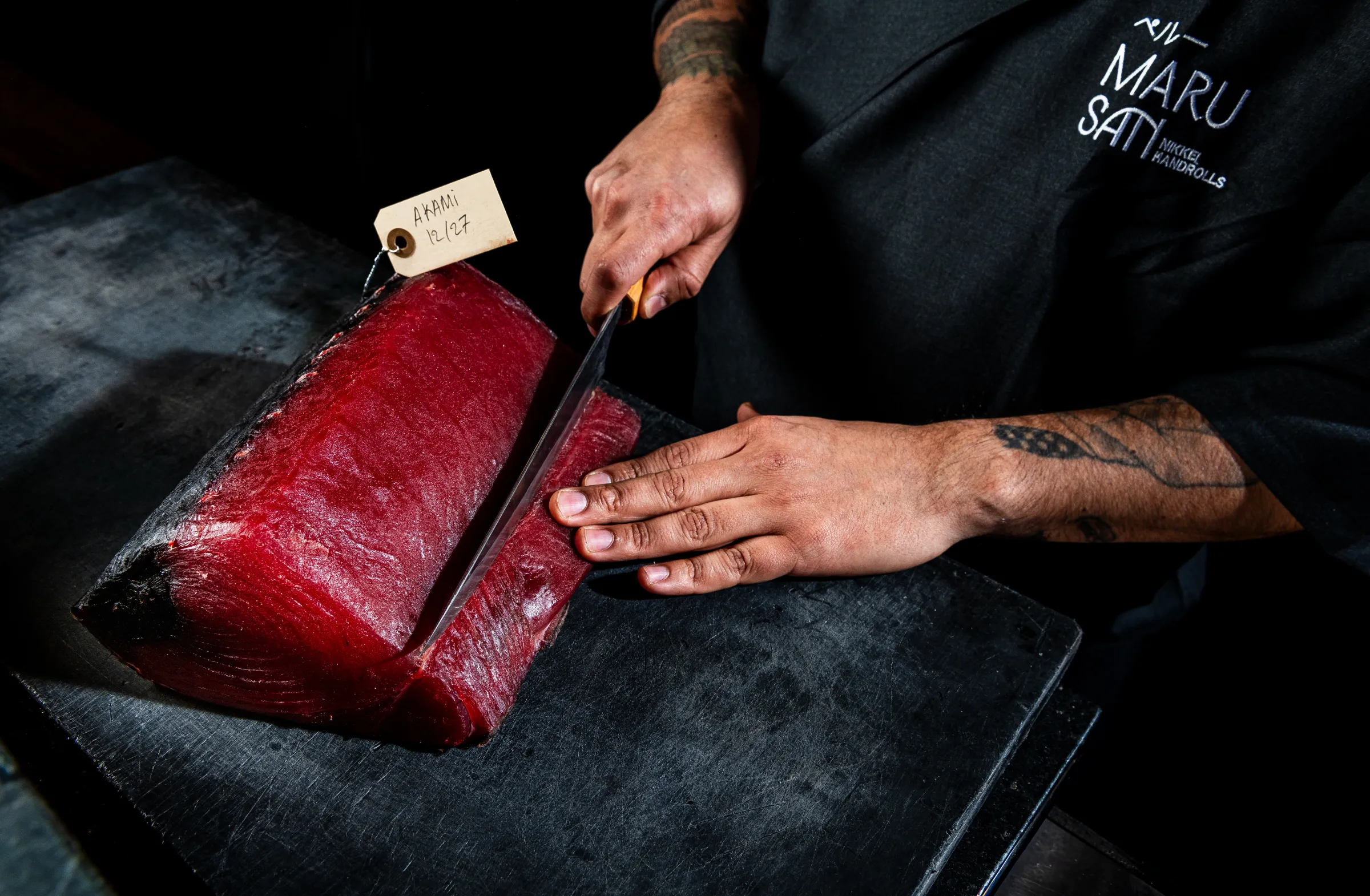 Maru San chef Carlos Delgado putting his slice skills to work.
