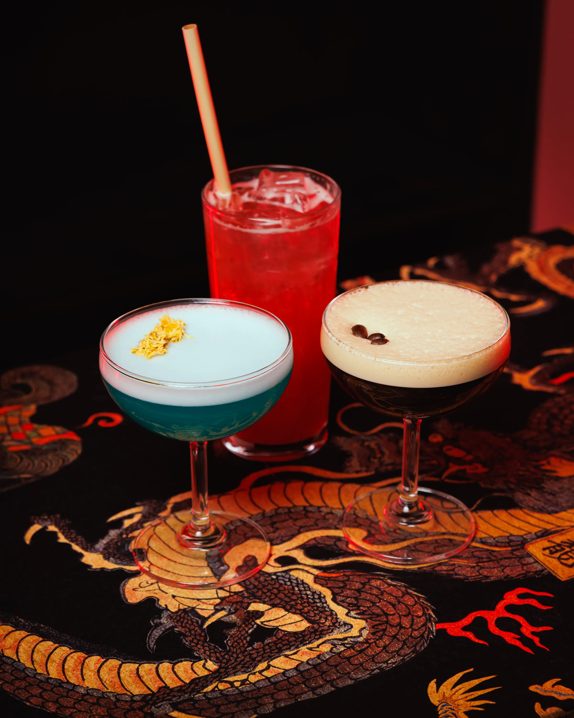 Cocktails intricately blend flavors of lychee, honey bush tea, sesame, five spice, and pandan.