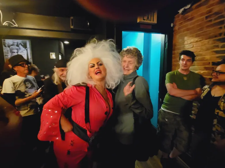 Kelli McVey Chovan, as Delvis, hams it up with Dreamlander Mary Vivian Pearce in the Lou Costello Room at Zissimo's Bar.