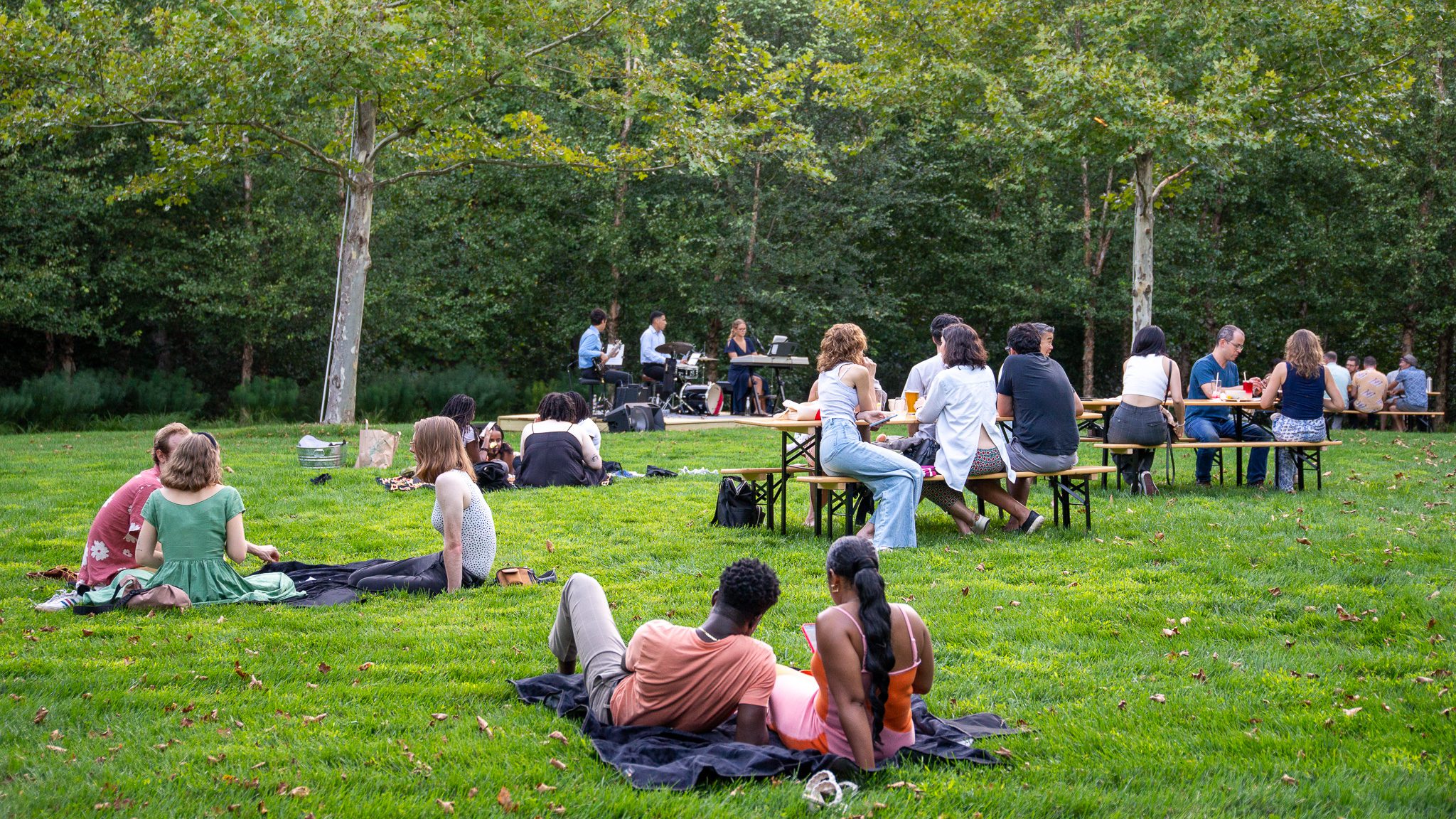 Glenstone Museum's Summer Evening Concerts with people sitting on benches and blankets