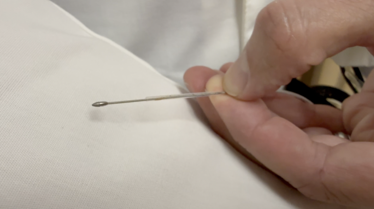 Dr. Voss demonstrating the tool used during the procedure