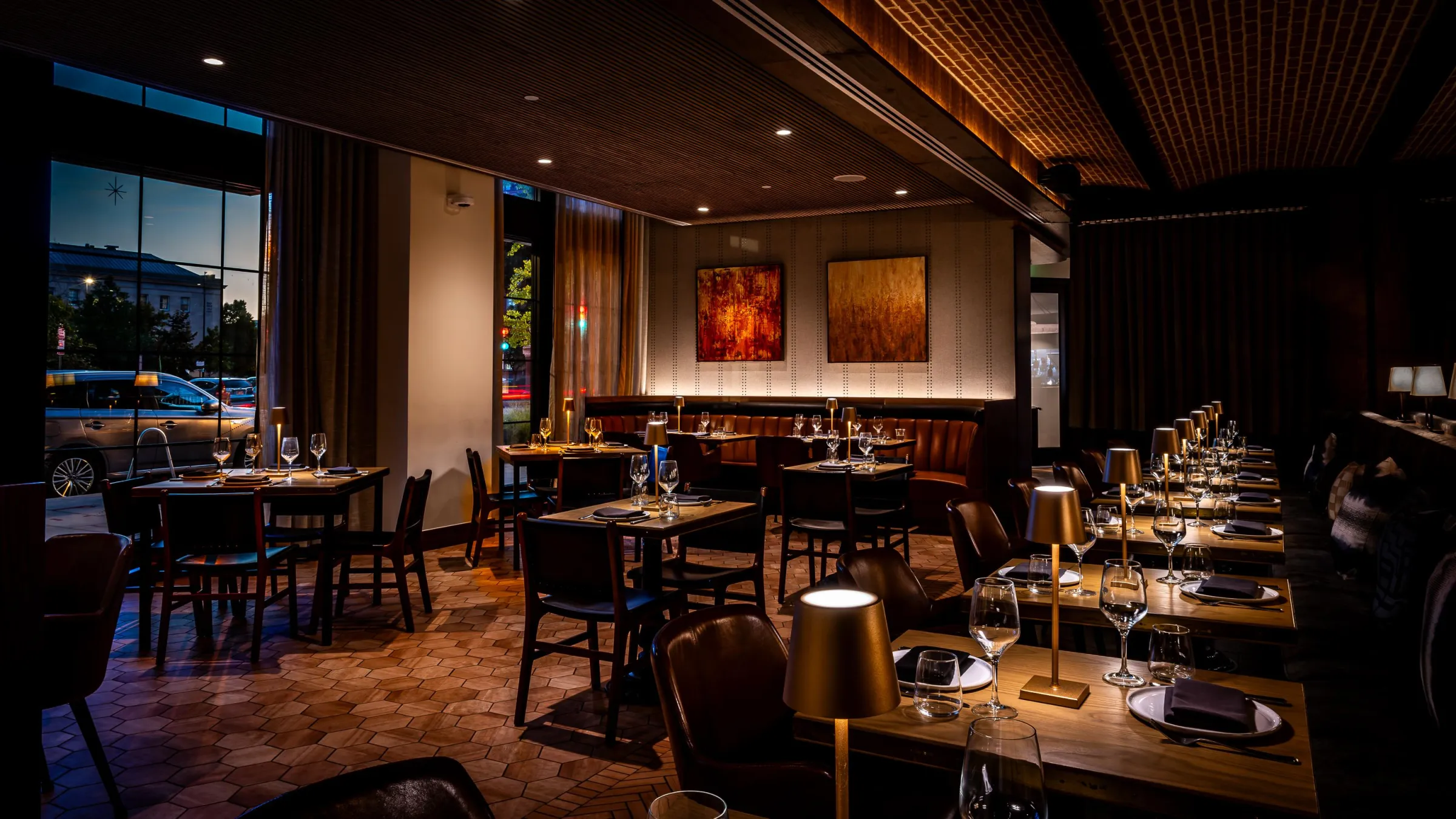 An intimate dining section featuring banquettes and decorative textiles.