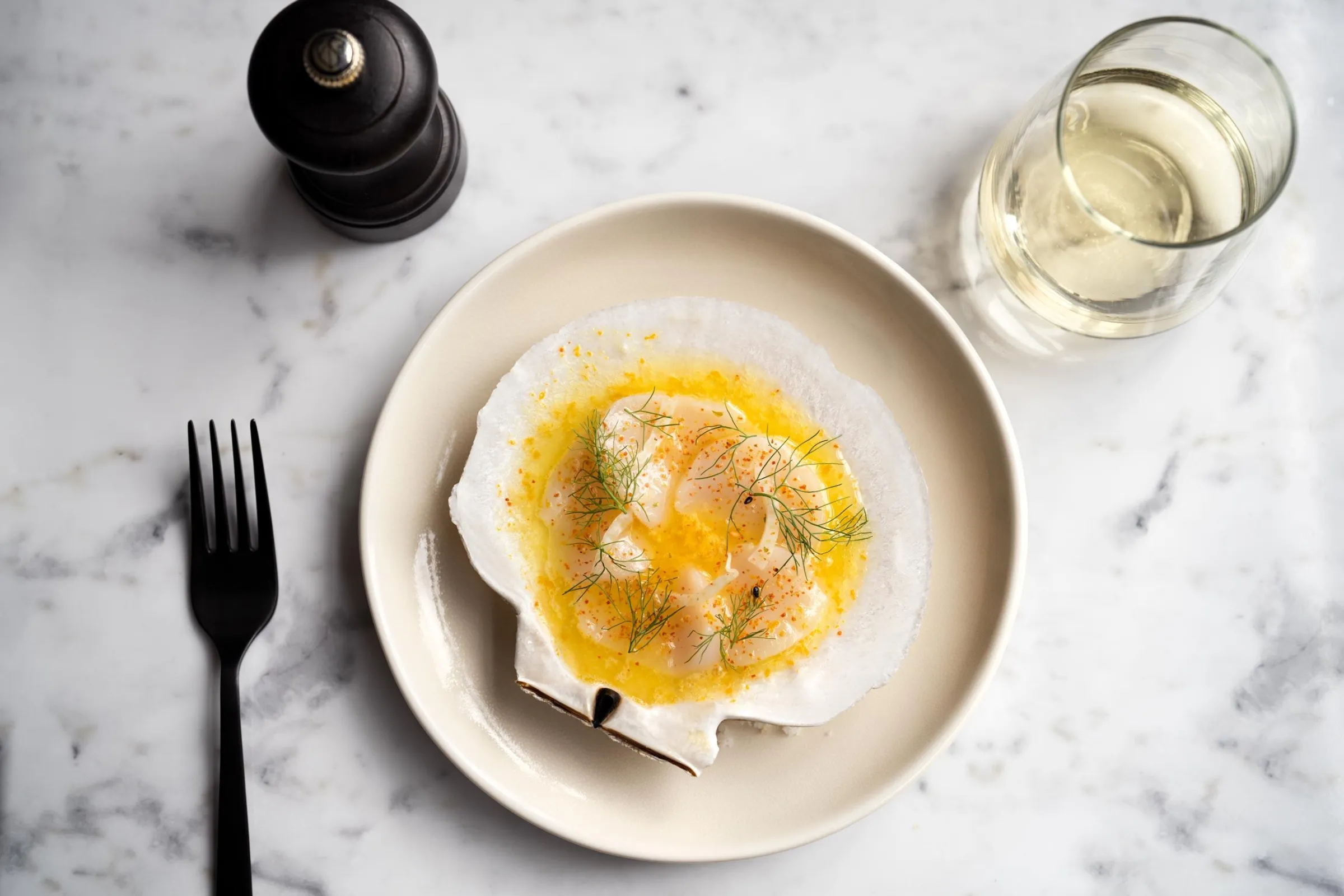 Diver scallops served with celery root, crispy leeks, and banyuls-port reduction.